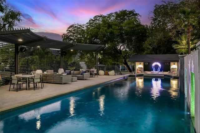 pool with a patio, outdoor lounge area, and a pergola