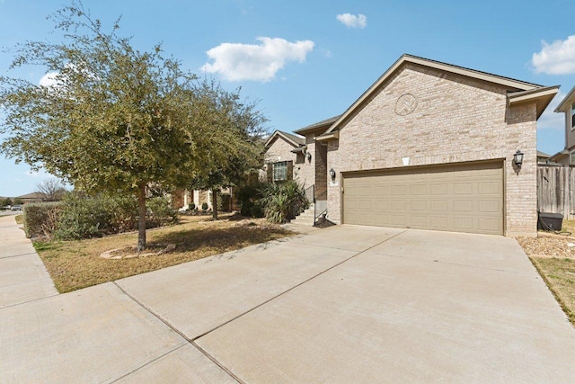 view of front of house with an attached garage and driveway