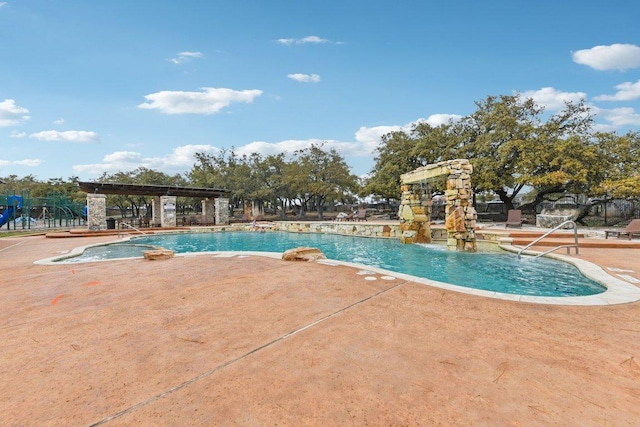 community pool featuring a patio and a pergola