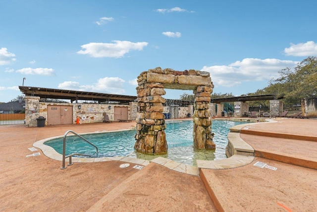 pool featuring a patio area