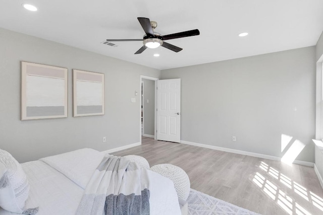 bedroom featuring visible vents, wood finished floors, recessed lighting, baseboards, and ceiling fan