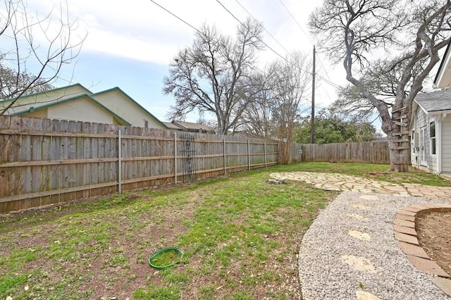 view of yard featuring a fenced backyard