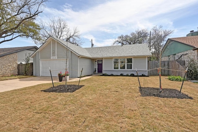 ranch-style house with a front yard, fence, a shingled roof, concrete driveway, and brick siding