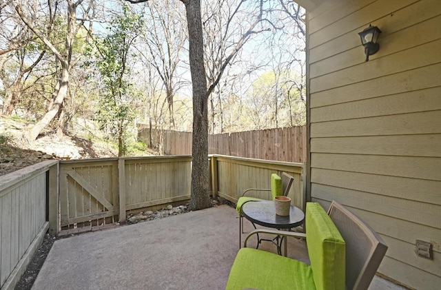 view of patio / terrace featuring fence