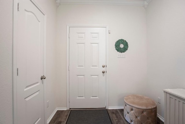 doorway to outside with baseboards, dark wood finished floors, and ornamental molding