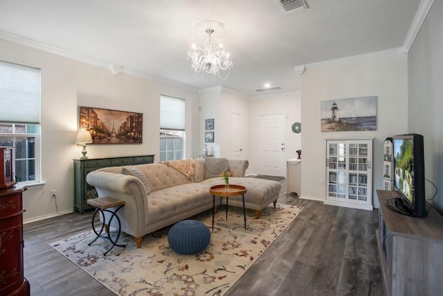 living area with a chandelier, visible vents, and ornamental molding