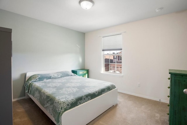 carpeted bedroom with baseboards