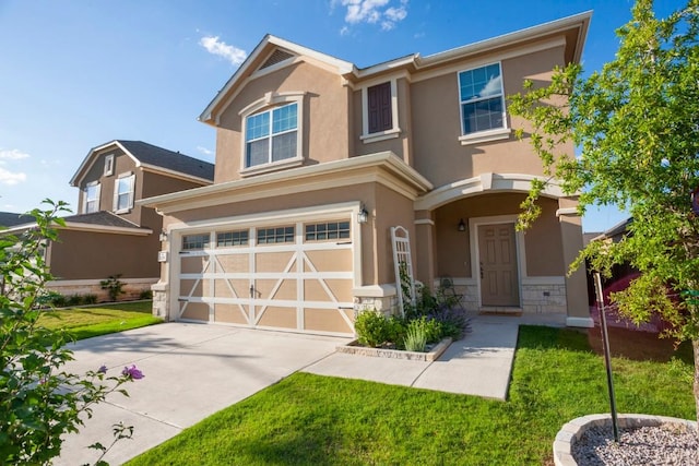 view of front facade featuring stucco siding, driveway, stone siding, a front yard, and a garage