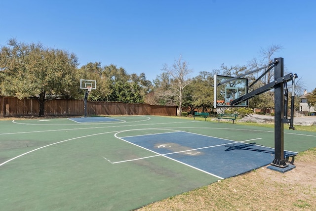 view of sport court with fence and basketball court