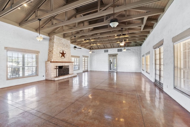 unfurnished living room featuring beam ceiling, high vaulted ceiling, ceiling fan, and a fireplace