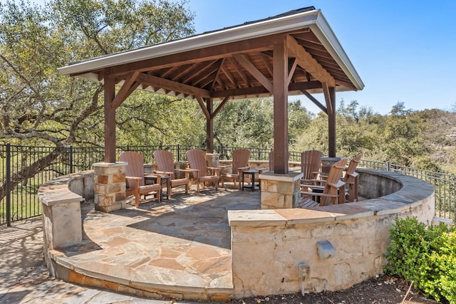 view of patio featuring a gazebo and fence