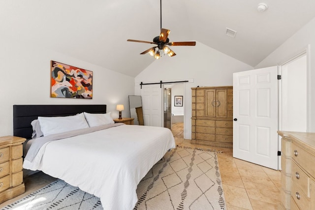 bedroom featuring light tile patterned floors, a ceiling fan, visible vents, lofted ceiling, and a barn door