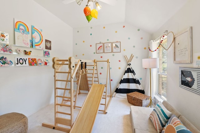 carpeted bedroom with lofted ceiling