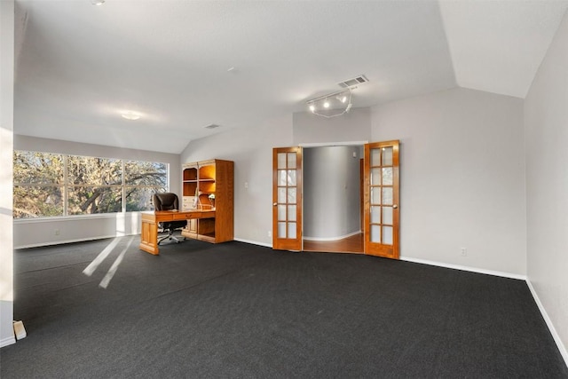 carpeted spare room featuring lofted ceiling, french doors, visible vents, and baseboards