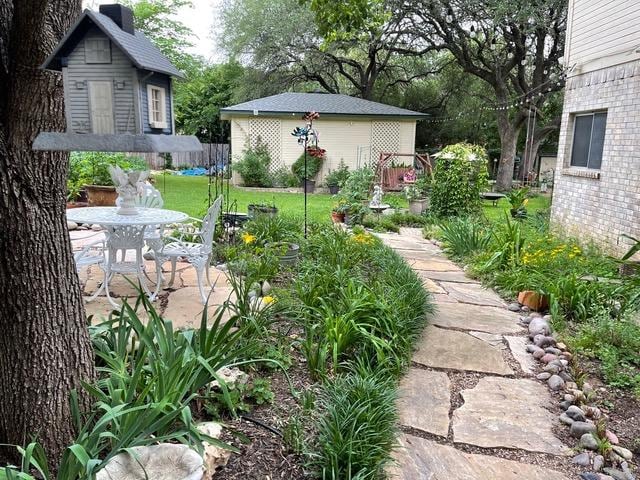 view of yard with a patio area and an outdoor structure