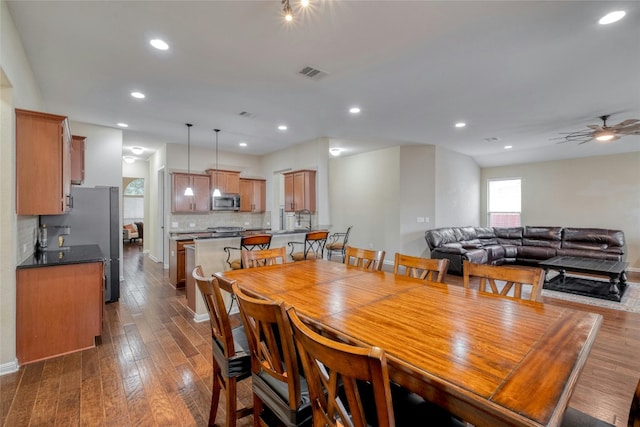 dining space featuring a ceiling fan, recessed lighting, dark wood-style floors, and visible vents