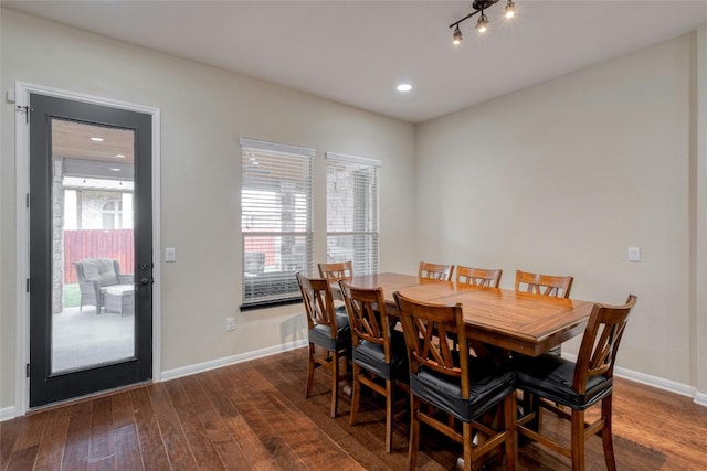 dining space with recessed lighting, baseboards, and wood-type flooring