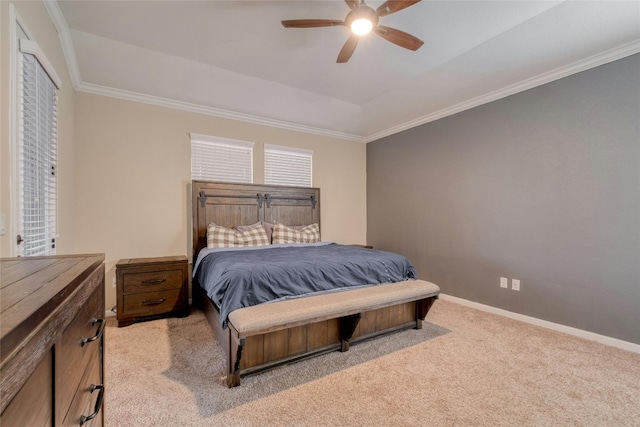 bedroom featuring light colored carpet, ornamental molding, baseboards, and a ceiling fan