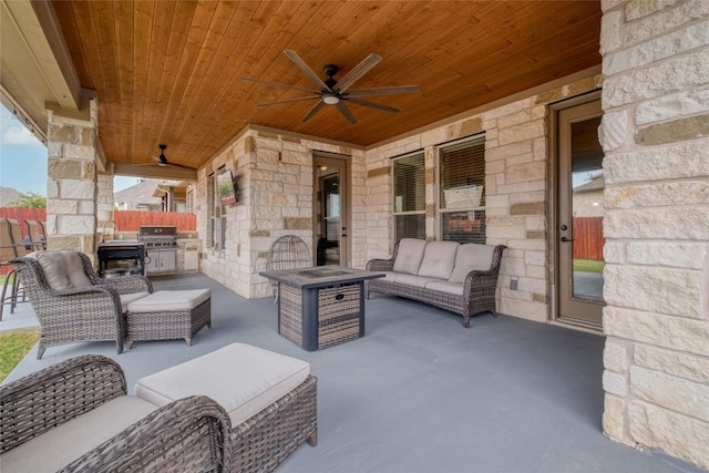 view of patio with an outdoor living space, ceiling fan, and grilling area