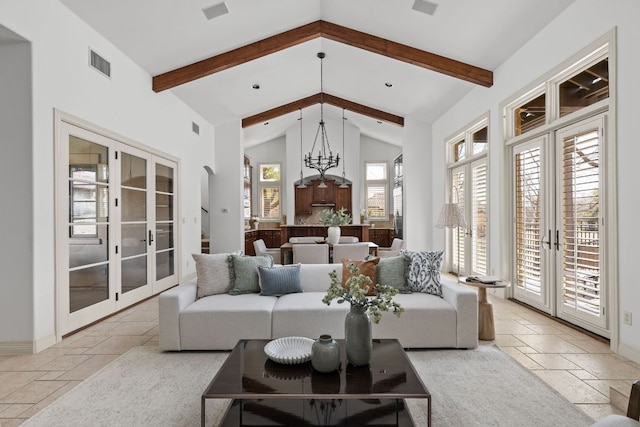 9100 Calera Dr Unit 10, Austin, TX 78735 - living area with french doors, stone tile floors, and a chandelier