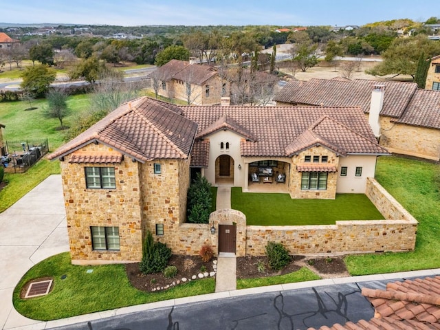 9100 Calera Dr Unit 10, Austin, TX 78735 - mediterranean / spanish house with a tiled roof, stucco siding, stone siding, and a front lawn