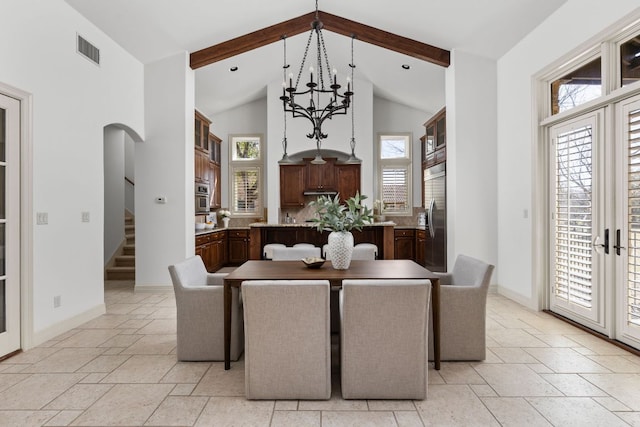 9100 Calera Dr Unit 10, Austin, TX 78735 - dining space featuring arched walkways, healthy amount of natural light, beamed ceiling, high vaulted ceiling, and stairs