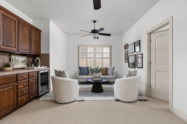 9100 Calera Dr Unit 10, Austin, TX 78735 - sitting room with wine cooler, a ceiling fan, light carpet, and baseboards