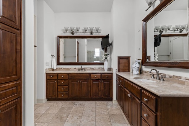 full bathroom featuring two vanities and a sink