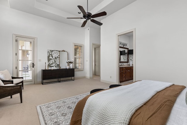 9100 Calera Dr Unit 10, Austin, TX 78735 - bedroom featuring light colored carpet, access to outside, ceiling fan, a high ceiling, and a raised ceiling