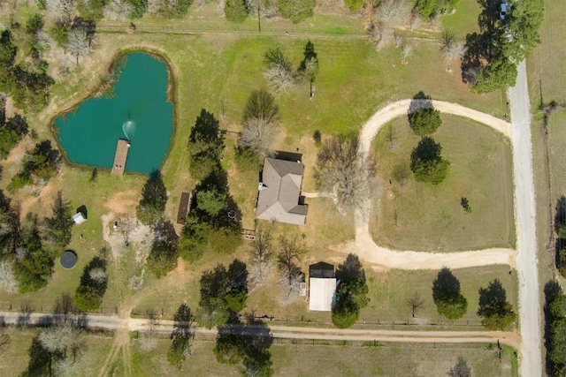 birds eye view of property featuring a rural view and a water view