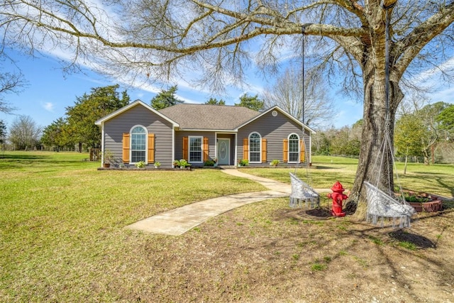 ranch-style home featuring a front lawn