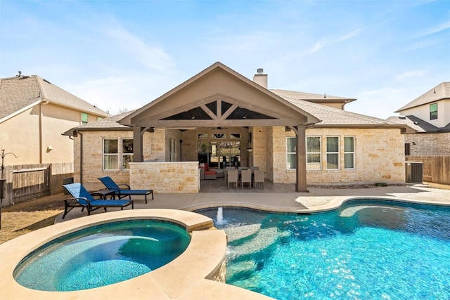 view of swimming pool featuring a pool with connected hot tub, ceiling fan, fence, central air condition unit, and a patio area