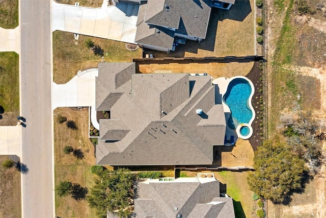 drone / aerial view of a pool