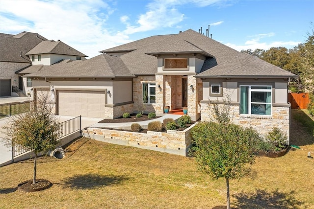 view of front of house featuring stucco siding, stone siding, and concrete driveway