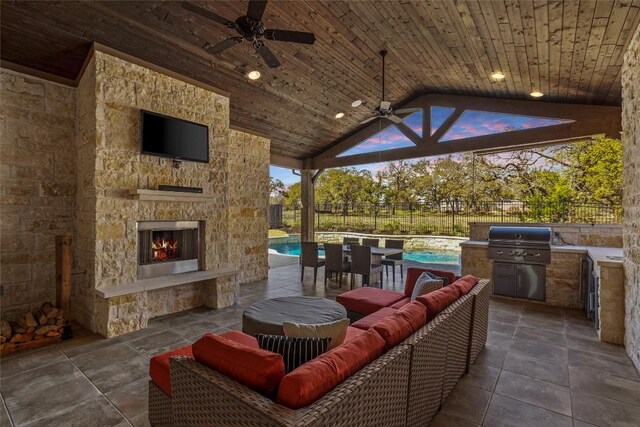 530 Crosswater Ln, Dripping Springs, TX 78620 - view of patio / terrace with a ceiling fan, an outdoor living space with a fireplace, and an outdoor pool