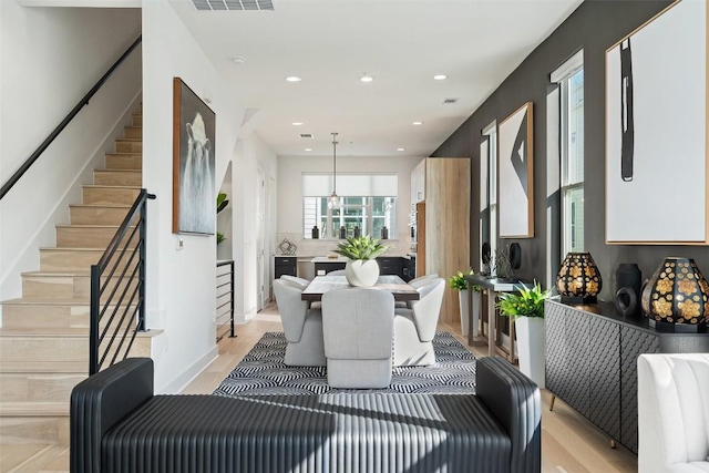 interior space with stairs, light wood-style flooring, recessed lighting, and visible vents