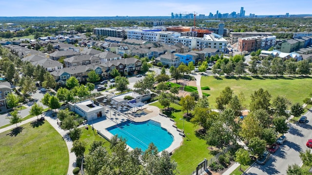 birds eye view of property featuring a city view