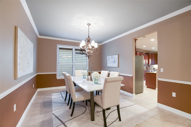 dining space featuring light tile patterned flooring, baseboards, an inviting chandelier, and ornamental molding