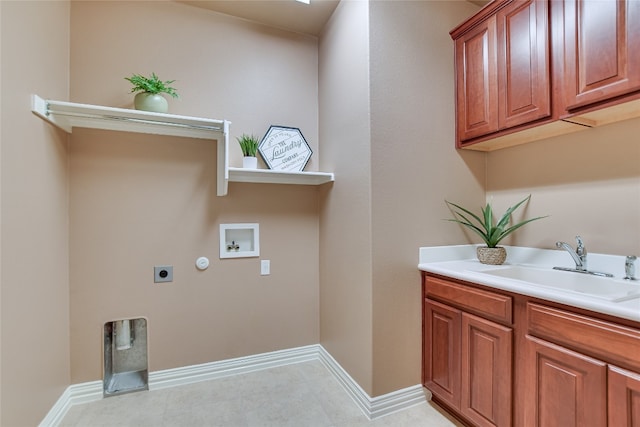 laundry area with electric dryer hookup, washer hookup, a sink, cabinet space, and baseboards