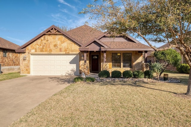 view of front of home featuring a front lawn, an attached garage, stone siding, and driveway