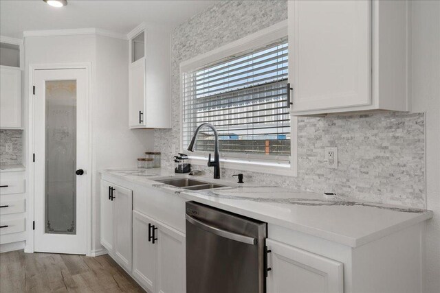 kitchen featuring a sink, dishwasher, white cabinets, and light wood finished floors