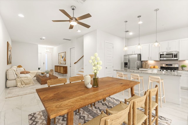 dining area featuring visible vents, stairs, recessed lighting, marble finish floor, and a ceiling fan