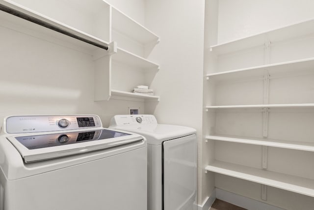 laundry room with laundry area and washer and clothes dryer