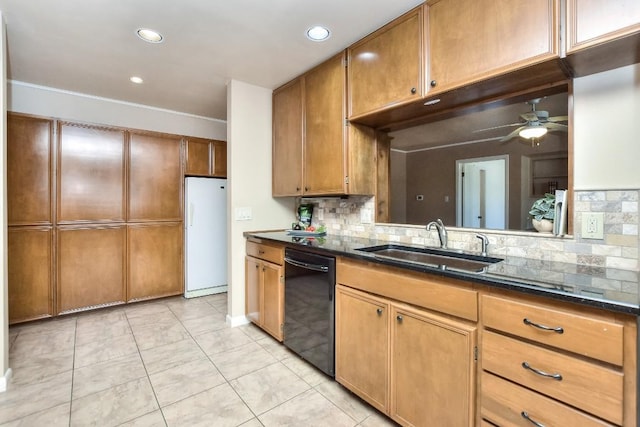 kitchen featuring ceiling fan, a sink, black dishwasher, white refrigerator, and brown cabinets