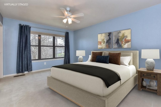 bedroom with visible vents, baseboards, a ceiling fan, and carpet flooring