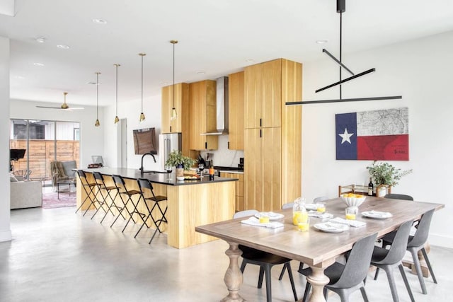 dining area with recessed lighting, a ceiling fan, and concrete flooring