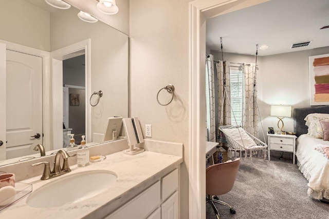 full bathroom with vanity and visible vents