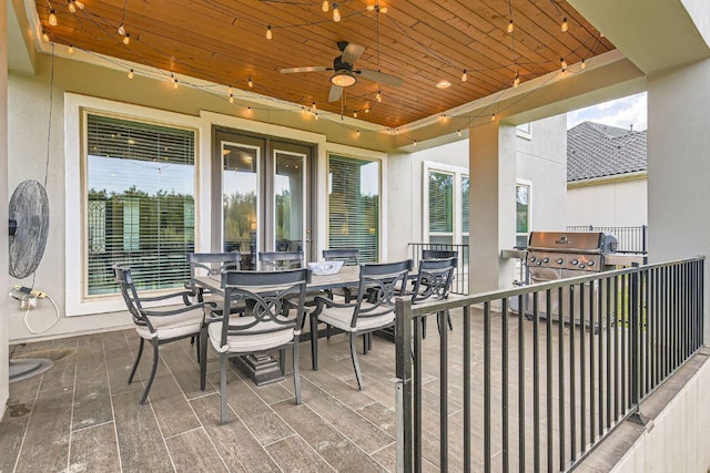 view of patio featuring a grill, outdoor dining area, and a ceiling fan