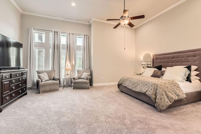 carpeted bedroom featuring baseboards, a ceiling fan, and crown molding