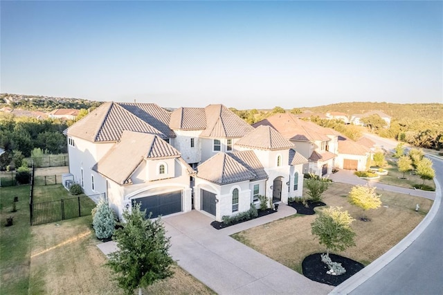 921 Morning Moon Cir, Austin, TX 78732 - view of front of property featuring stucco siding, concrete driveway, an attached garage, a residential view, and a tiled roof